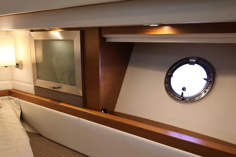 Slide: The Image of Interior of 2020 Tiara Yachts C44 Coupe with porthole and modern design elements. - 81