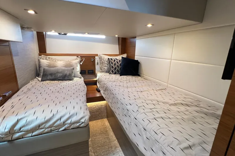 Slide: The Image of Interior of 2020 Tiara Yachts C44 Coupe with twin beds and modern decor. - 87