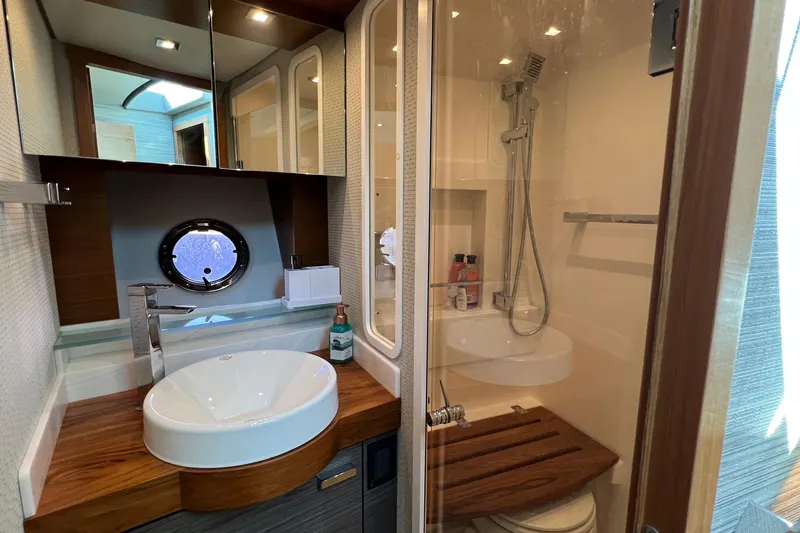 Slide: The Image of Luxurious bathroom in 2020 Tiara Yachts C44 Coupe with modern fixtures and shower. - 93