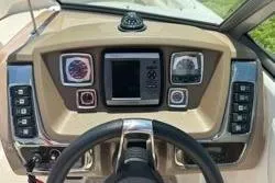 Slide: The Image of Dashboard of 2013 Chaparral Sunesta 224 boat with steering wheel and control panel. - 10
