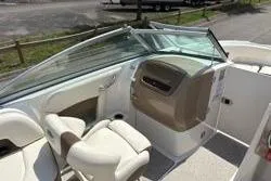 Slide: The Image of 2013 Chaparral Sunesta 224 boat interior with seating and dashboard view. - 11