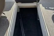 Slide: The Image of 2013 Chaparral Sunesta 224 boat storage compartment with open hatch. - 13