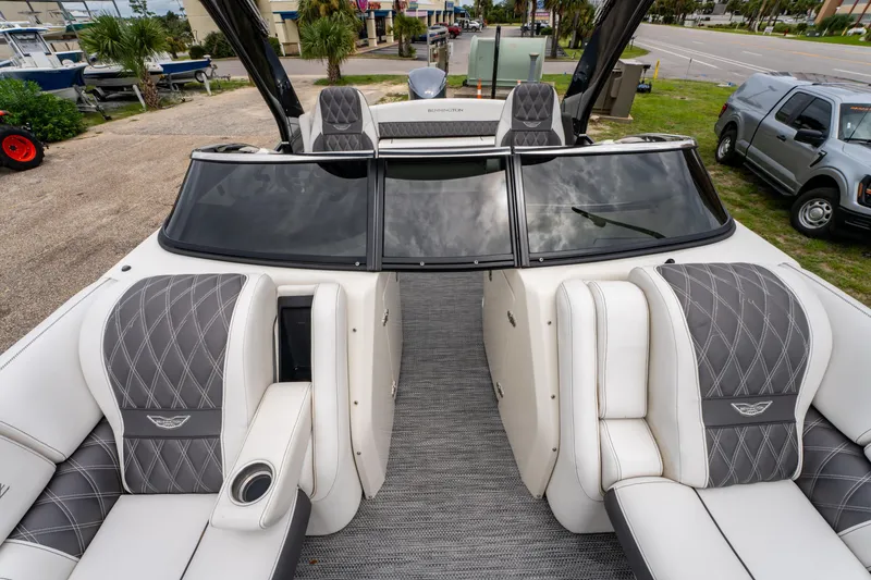 Slide: The Image of 2021 Bennington R25 Sport boat interior with luxurious seating and sleek design. - 15