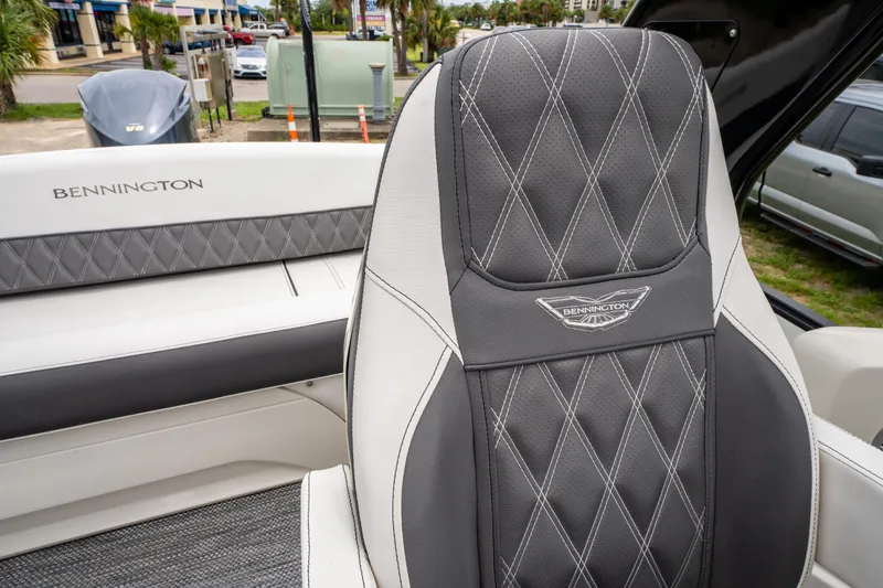 Slide: The Image of 2021 Bennington R25 Sport boat seat with diamond-stitched upholstery and logo detail. - 29