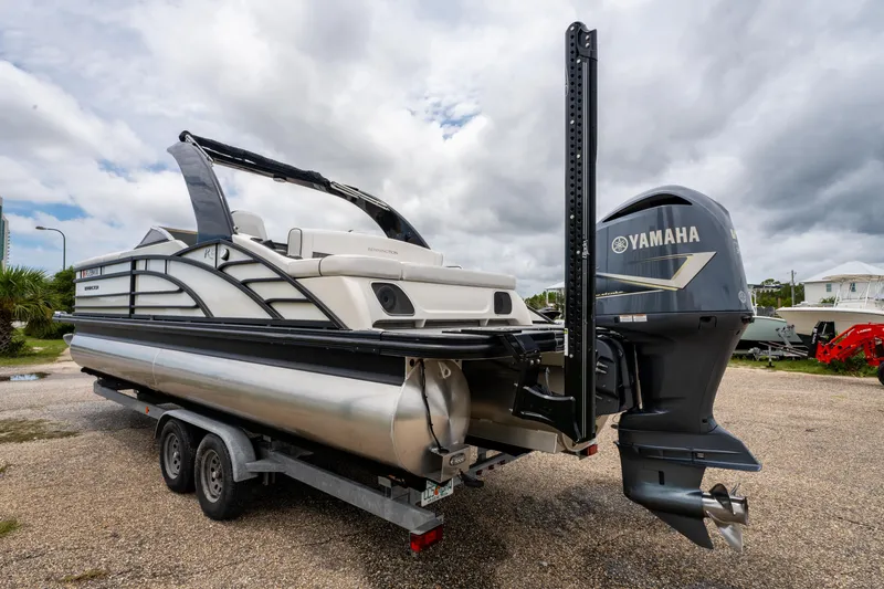 Slide: The Image of 2021 Bennington R25 Sport pontoon boat with Yamaha engine on trailer. - 3