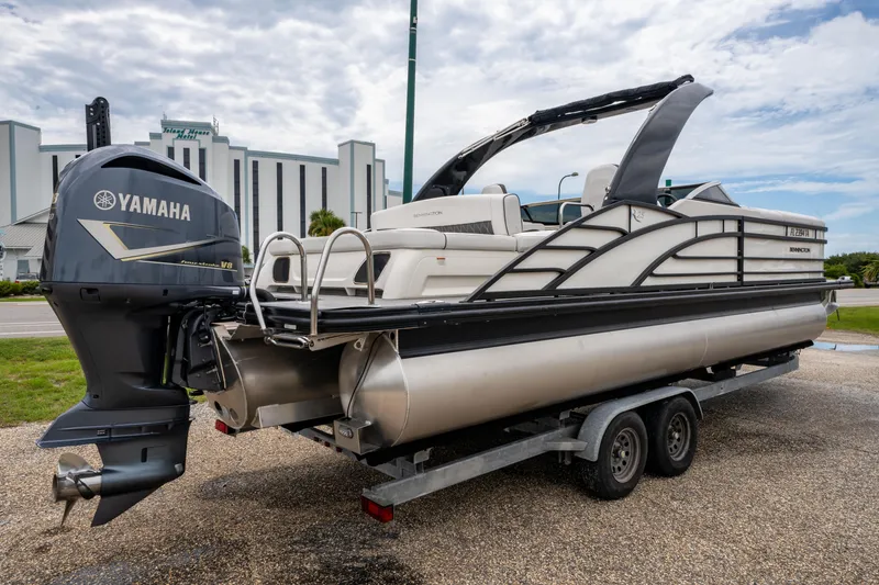 Slide: The Image of 2021 Bennington R25 Sport pontoon boat with Yamaha V8 engine on a trailer. - 7