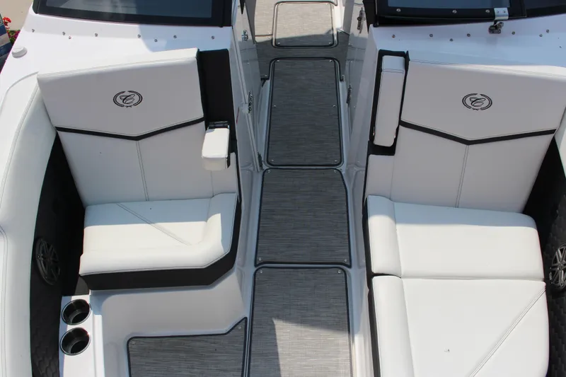 Slide: The Image of 2025 Cobalt R8 Surf boat interior with white seating and sleek design. - 18
