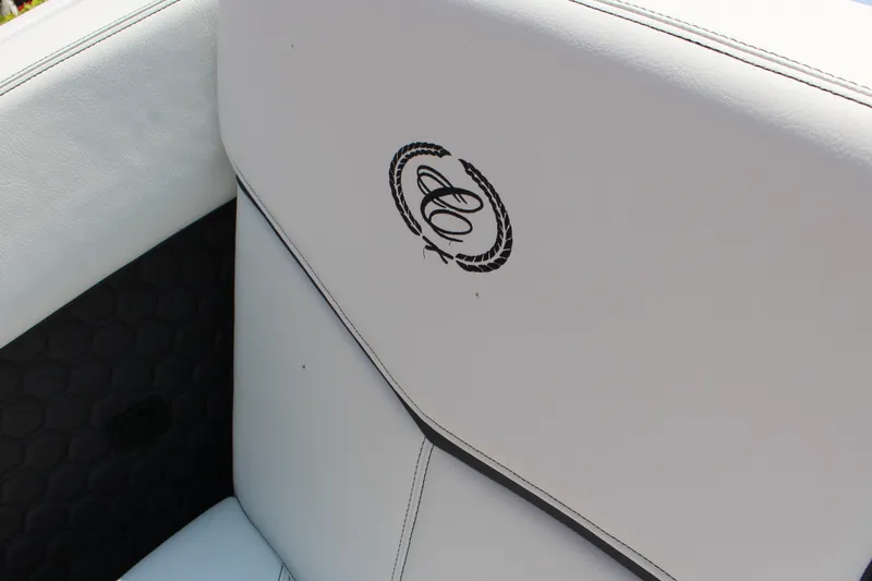 Slide: The Image of 2025 Cobalt R8 Surf boat interior with logo on white upholstery. - 20