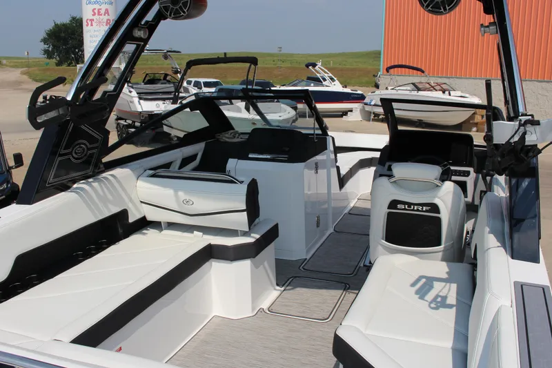 Slide: The Image of 2025 Cobalt R8 Surf boat interior with sleek seating and modern design. - 23