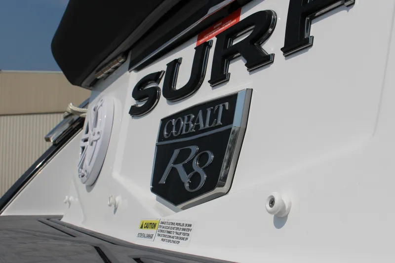 Slide: The Image of 2025 Cobalt R8 Surf boat emblem on white surface. - 25