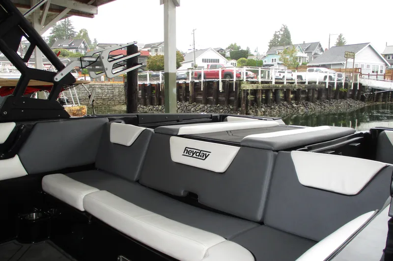 Slide: The Image of 2023 Heyday WT-2DC boat interior with sleek seating, dockside view. - 11