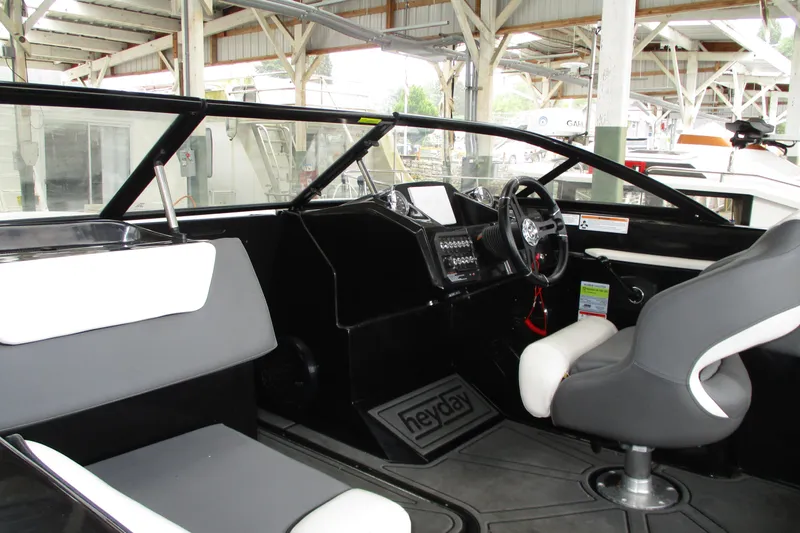 Slide: The Image of 2023 Heyday WT-2DC boat interior with modern dashboard and seating. - 6