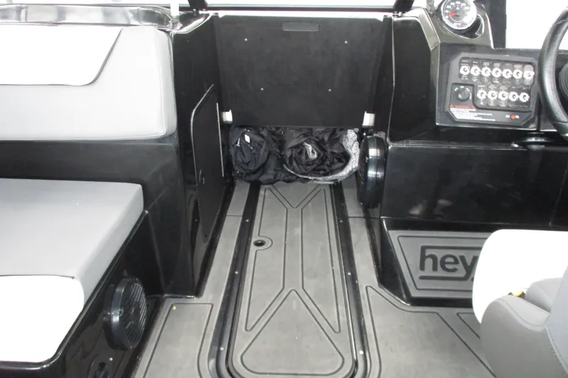 Slide: The Image of Interior of 2023 Heyday WT-2DC boat, featuring seating and control panel. - 9