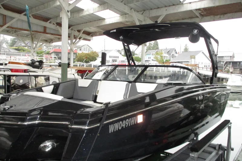 The Image of 2023 Heyday WT-2DC boat docked under a covered marina. - 0