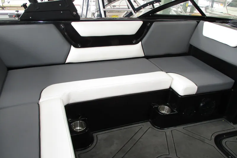 Slide: The Image of 2023 Heyday WT-2DC boat interior with gray and white seating, featuring cup holders. - 10