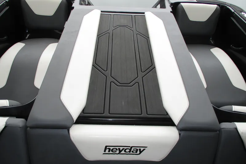 Slide: The Image of 2023 Heyday WT-2DC boat interior with sleek black and white seating design. - 15