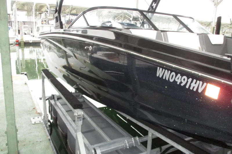 Slide: The Image of 2023 Heyday WT-2DC boat docked, side view with registration number visible. - 20