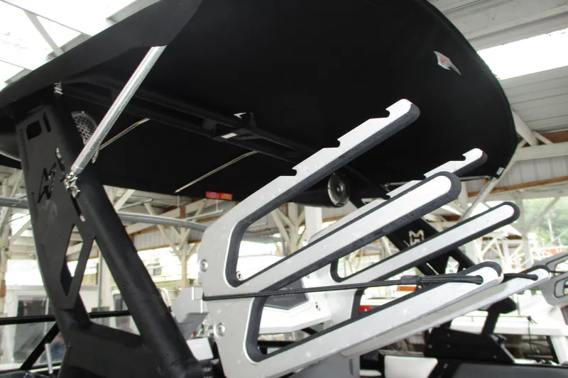 Slide: The Image of 2023 Heyday WT-2DC boat with wakeboard rack under a covered dock. - 23