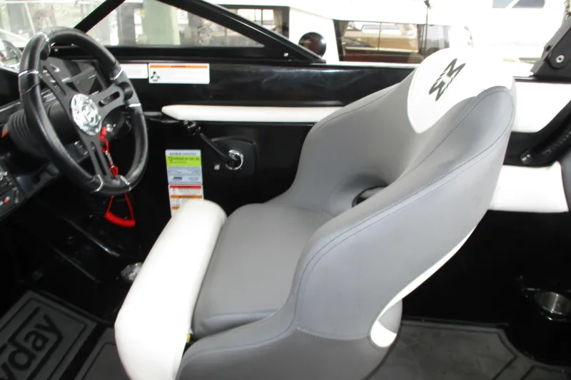Slide: The Image of 2023 Heyday WT-2DC boat interior with steering wheel and cushioned seat. - 8