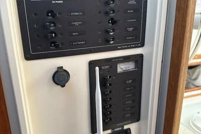 Slide: The Image of Electrical control panel on a 2008 Dyer 29 boat, featuring various switches and indicators. - 11