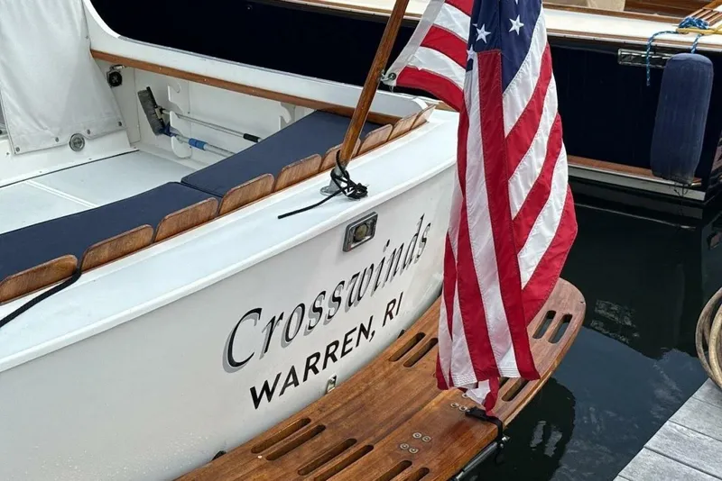 Slide: The Image of Dyer 29 boat, 2008 model, named "Crosswinds" with American flag, docked in Warren, RI. - 13