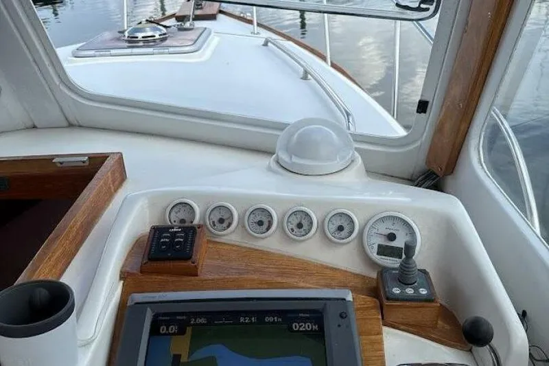 Slide: The Image of Cockpit view of a 2008 Dyer 29 boat with navigation instruments. - 3