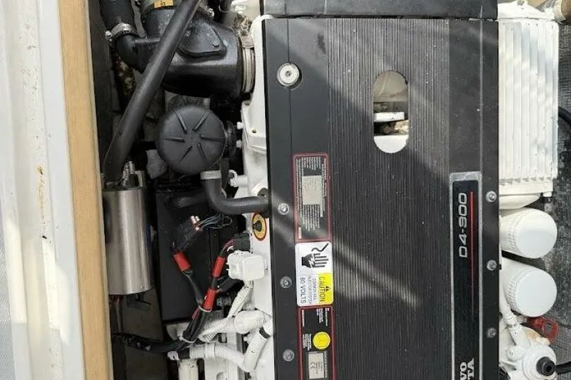 Slide: The Image of Engine compartment of a 2008 Dyer 29 boat, featuring a Volvo Penta D4-300 engine. - 9