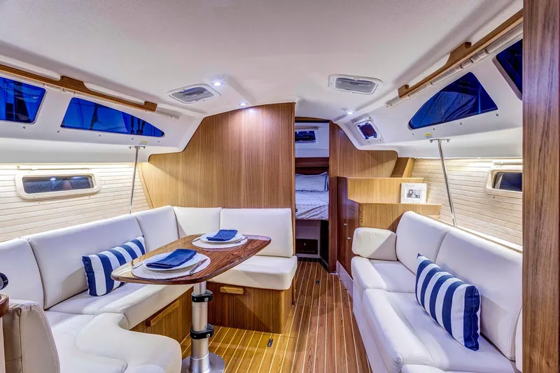 Slide: The Image of Luxurious interior of 2026 Catalina 316 yacht with elegant seating and dining area. - 16