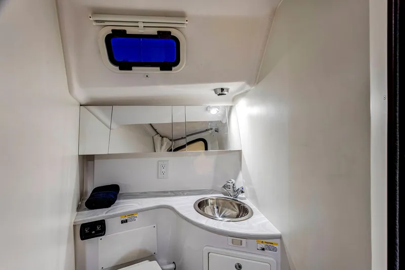 Slide: The Image of Compact bathroom in 2026 Catalina 316 boat with sink, mirror, and window. - 20