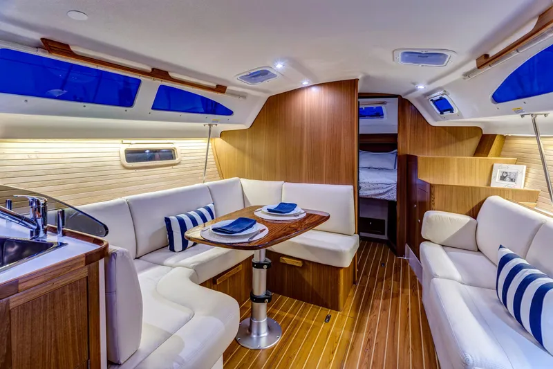 Slide: The Image of Luxurious interior of 2026 Catalina 316 yacht with elegant seating and dining area. - 21