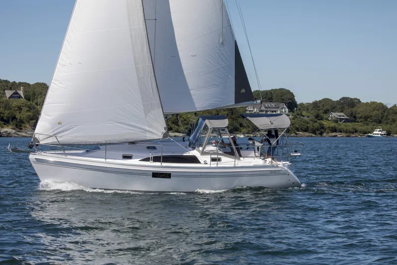 Slide: The Image of Sailing yacht Catalina 316, 2026 model, cruising on a sunny day near the coastline. - 4