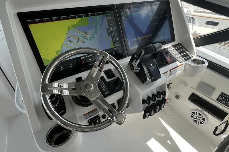 Slide: The Image of 2023 Intrepid 477 Evolution helm with advanced navigation displays and controls. - 16