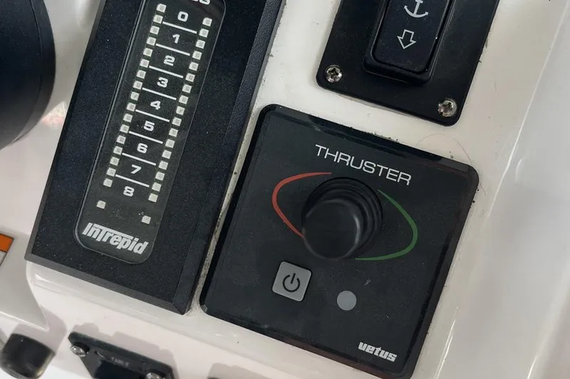 Slide: The Image of Control panel of 2023 Intrepid 477 Evolution boat with thruster joystick. - 20