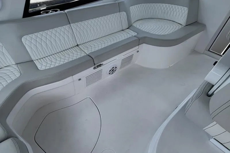 Slide: The Image of Luxurious seating area on 2023 Intrepid 477 Evolution boat with quilted upholstery. - 28