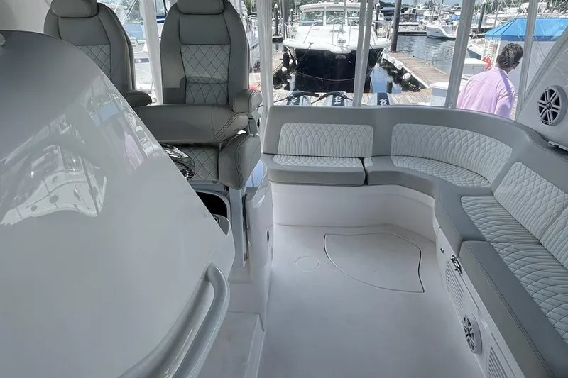 Slide: The Image of Interior of 2023 Intrepid 477 Evolution yacht with luxurious seating and modern design. - 29