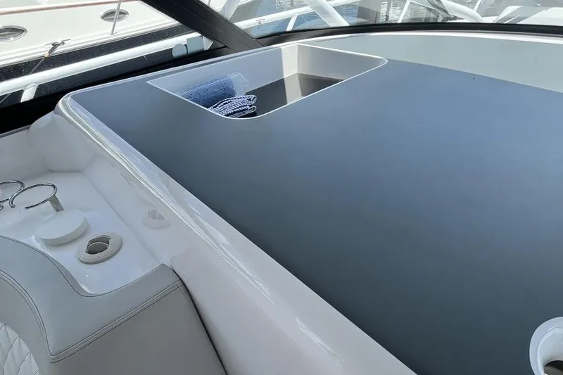 Slide: The Image of 2023 Intrepid 477 Evolution boat interior with sleek design and modern amenities. - 33