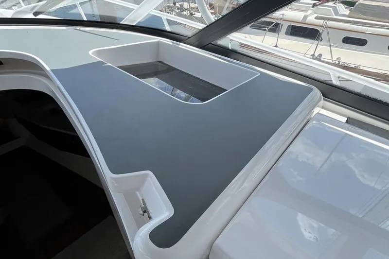 Slide: The Image of 2023 Intrepid 477 Evolution yacht interior with sleek design and modern features. - 35