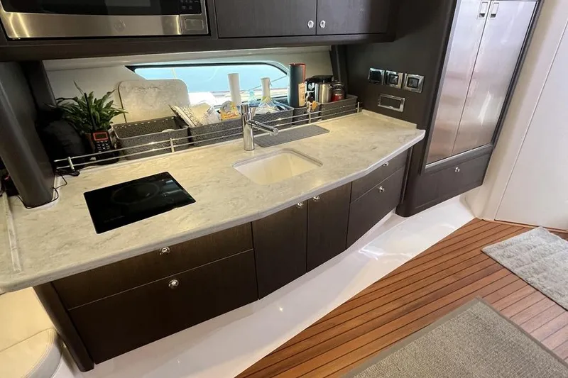 Slide: The Image of Luxurious kitchen interior of 2023 Intrepid 477 Evolution yacht with modern amenities. - 45