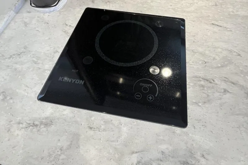 Slide: The Image of Kenyon cooktop on Intrepid 477 Evolution 2023 yacht's sleek countertop. - 47