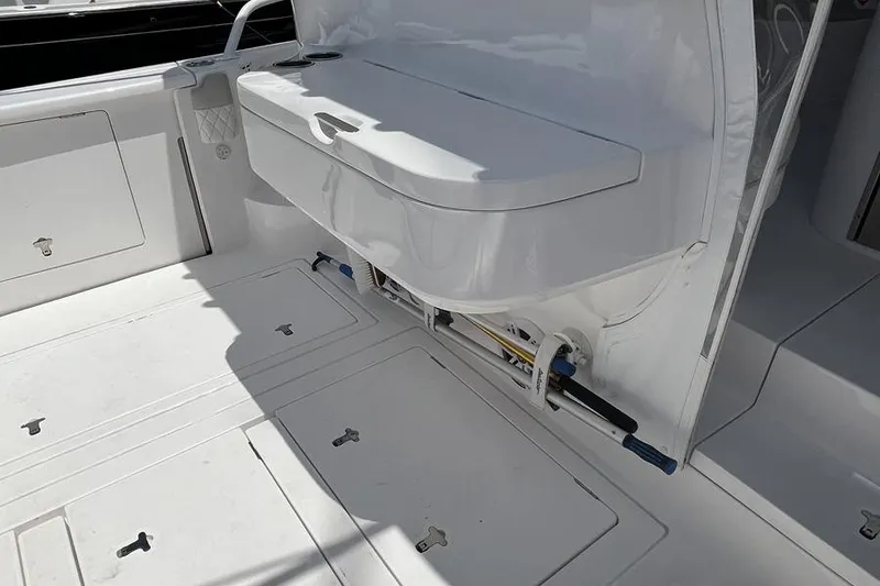 Slide: The Image of 2023 Intrepid 477 Evolution boat deck with storage compartments and seating area. - 58