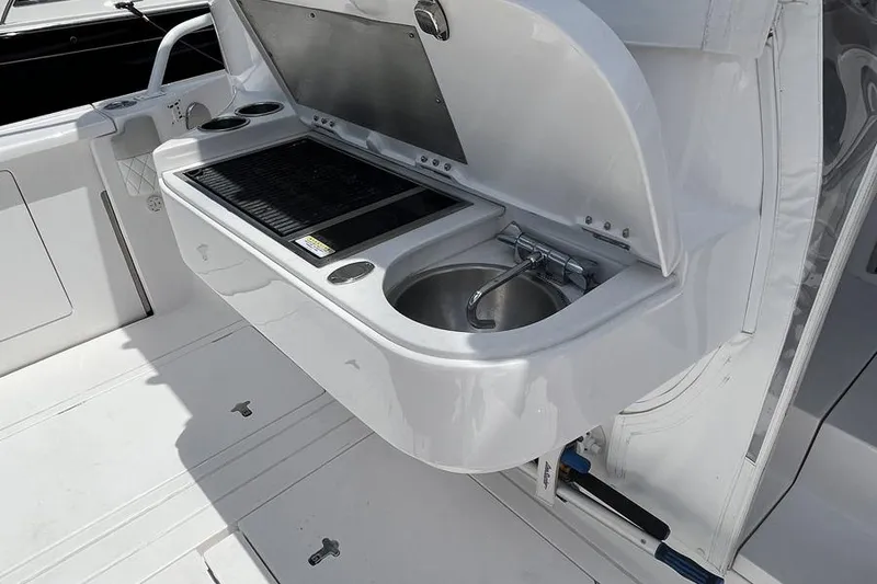 Slide: The Image of Outdoor kitchen on 2023 Intrepid 477 Evolution yacht with grill and sink. - 59
