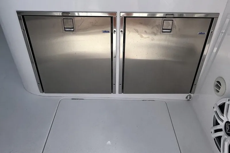 Slide: The Image of Stainless steel storage compartments on 2023 Intrepid 477 Evolution boat deck. - 62