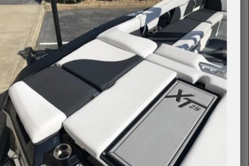Slide: The Image of 2019 MasterCraft XT25 boat interior with sleek seating and modern design. - 10