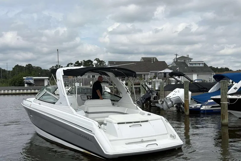 Slide: The Image of 2004 Formula 2800 BR boat docked at marina under cloudy sky. - 10