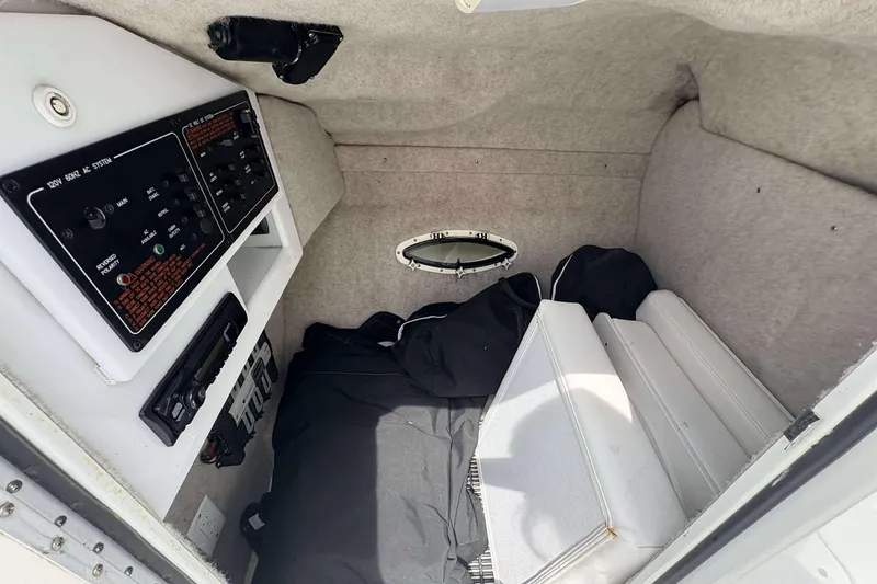 Slide: The Image of Interior cabin of a 2004 Formula 2800 BR boat, featuring control panels and seating. - 19