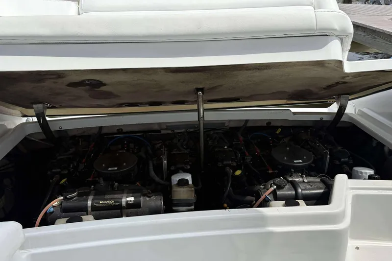 Slide: The Image of Open engine compartment of a 2004 Formula 2800 BR boat, showcasing dual engines. - 20