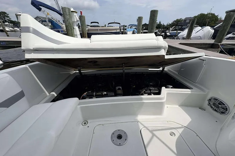 Slide: The Image of 2004 Formula 2800 BR boat engine compartment open at marina. - 21