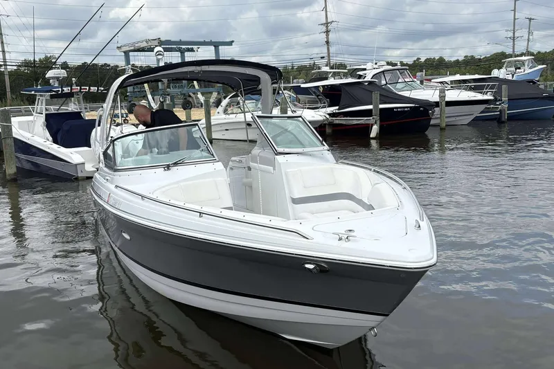 Slide: The Image of 2004 Formula 2800 BR boat docked at marina with other vessels. - 5