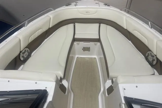Slide: The Image of 2014 Chaparral 257 SSX boat interior with white and brown seating. - 11
