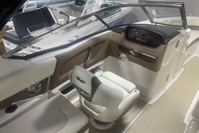 Slide: The Image of 2014 Chaparral 257 SSX boat interior with steering console and seating. - 8